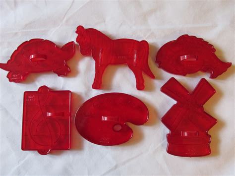 vintage red plastic cookie cutters rare shapes musical note windmill  plastic