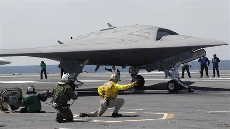 unmanned navy jet lands  aircraft carrier vermont