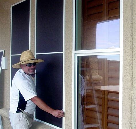 man   straw hat leaning   window   hand   glass