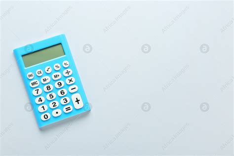 light blue calculator  light background top view space  text stock photo