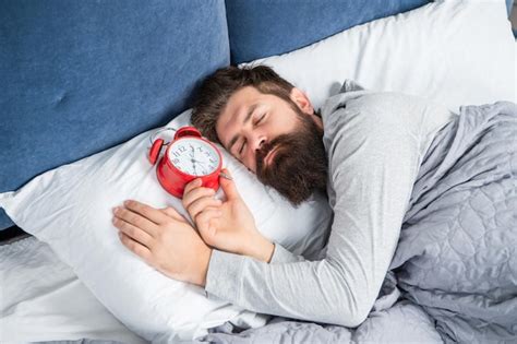 Premium Photo Sleepy Man With Alarm Clock Being In Bed Asleep Sleep Time