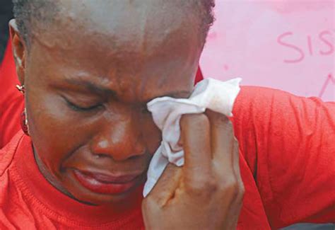 one of the mothers of the missing chibok girls cries during a rally by civil society groups