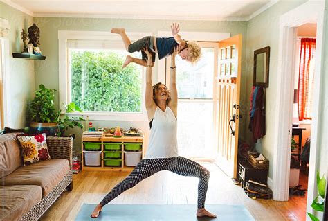Super Mom Doing Yoga With Son By Stocksy Contributor Kate Ames