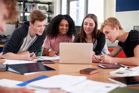 group  college students collaborating  project  library stock