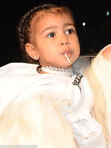 kanye west cuddles daughter north at his yeezy season three nyfw fashion show daily mail online