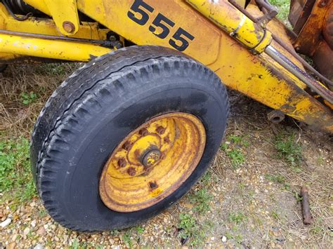 backhoe wd front rim  tire good  gulf south equipment sales