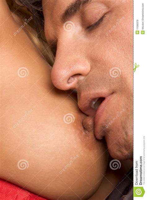 Couple Engaged In Sexual Games And Nipple Kissing Stock