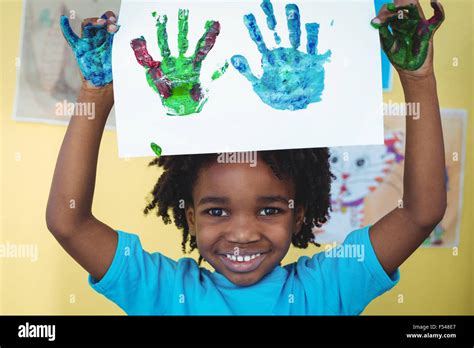smiling kid holding   hands stock photo alamy