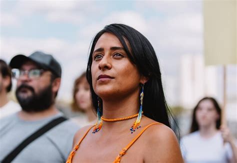 Premium Photo Indigenous Woman Standing In The Crowd With A Serious