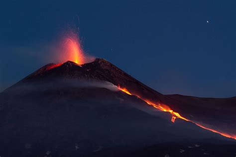 mount etna volcano erupting  sicily italy mirror