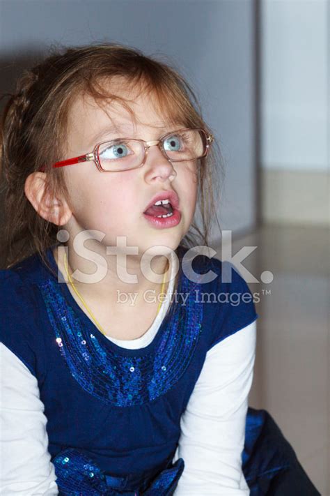 surprised  girl child open mouth wide eyed interior stock
