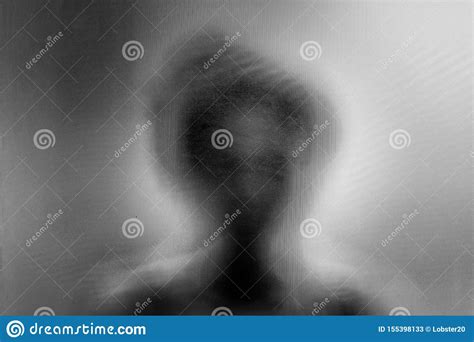 woman standing behind blurry glass stock image image of