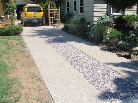 pebbled ribbon driveway driveway landscaping driveway design outdoor gardens