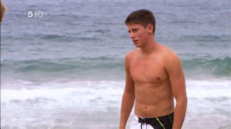 lincoln younes shirtless at the beach on home and away