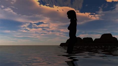 silhouette of teenager sits against sunset sky and throws stones into sea stock footage video