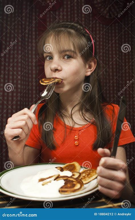 teen girl eats  pancake stock photo image  cake cuisine