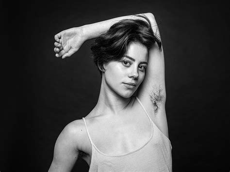 photographer questions beauty standards with photos of women with unshaven armpits