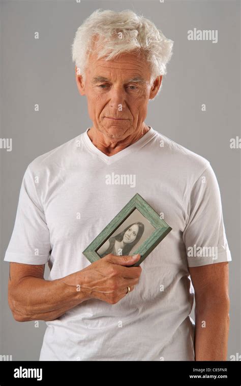 man holding photograph stock photo alamy