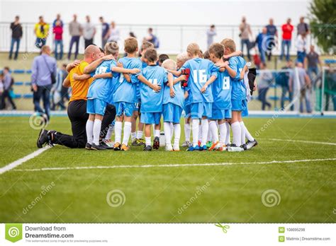 children soccer football team  coach group  kids standing