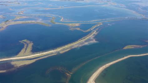 Aerial View Of A Vast Flooded Area With Sandy Strips Along The Lagoon
