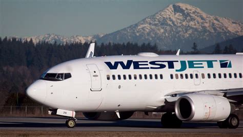 westjet targets high paying passengers  fuel costs  competition