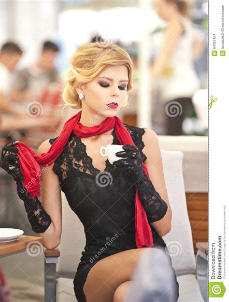 fashionable attractive lady with little black dress and