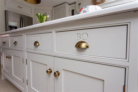 Bespoke Engravings On The Drawers Make This Shaker Kitchen Completely