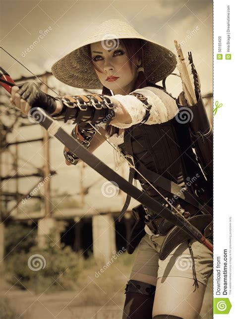 Attractive Woman Warrior Holding In Her Hands Bow And