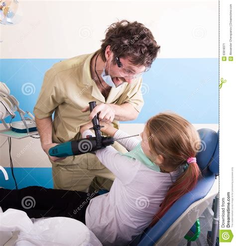 crazy dentist treats teeth of the unfortunate patient the patient is terrified stock image