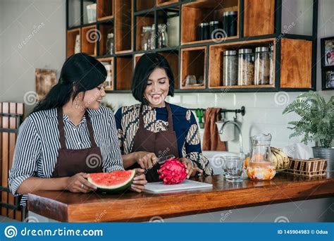 Mother And Daughter At Home Making Some Fresh Dessert Stock Image