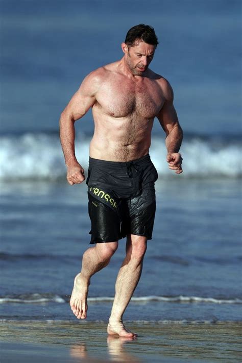 hugh jackman is looking fit as he jogs along a beach in sydney in