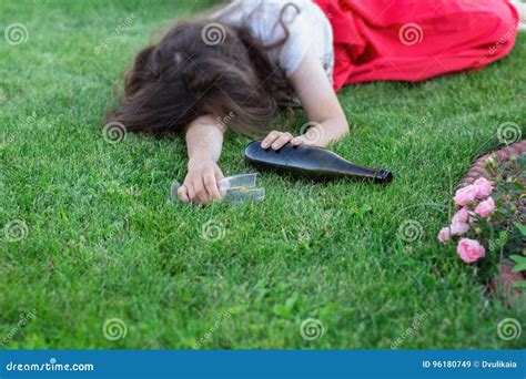 drunk girl sleeping in the park after the party royalty free stock
