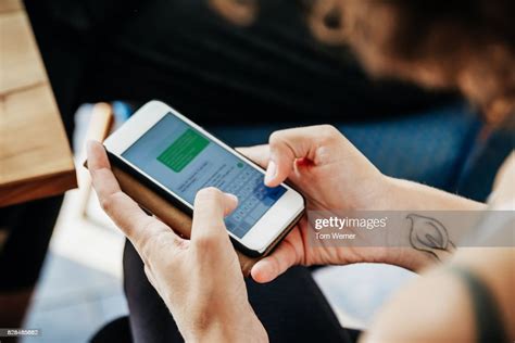 close up of woman messaging friends using smartphone photo getty images