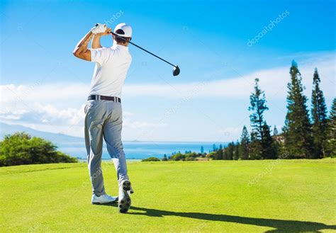 man playing golf hitting ball   tee stock photo