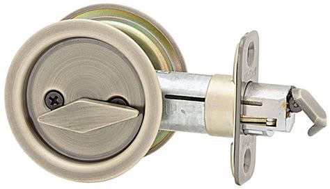 kwikset   antique brass  privacy bedbath pocket door lock handlesetscom