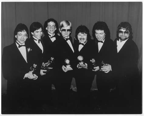 photograph   band members  toto holding grammy awards