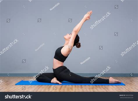 young asian woman practicing yoga pose stock photo edit