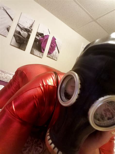 shiny red catsuit zenati gas mask harness strapon 16
