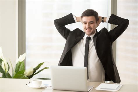 relaxed employee enjoying result of good job done free photo
