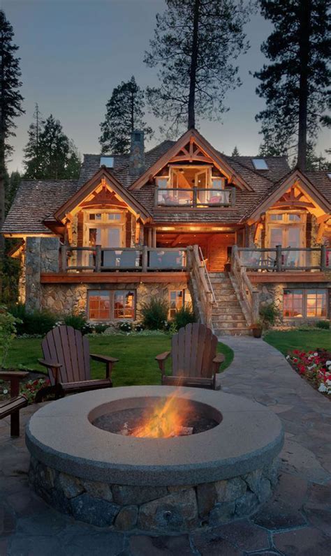 awesome mountain house  outdoor fireplace homemydesign