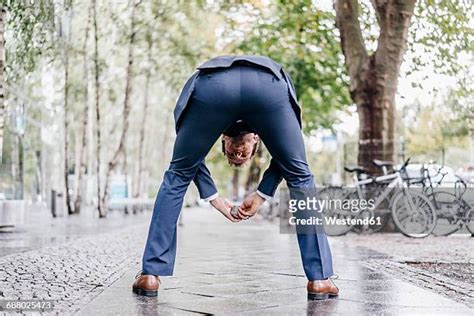 man bending over from behind bildbanksfoton och bilder getty images