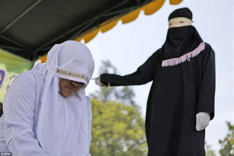 indonesian is whipped 100 times for sex outside marriage