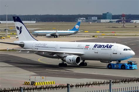 iran air passengers forced  spend  night   plane due  delays