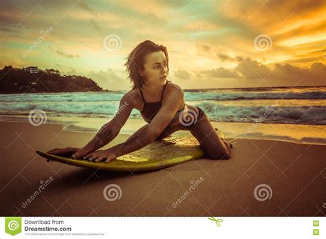 Beautiful Woman On The Beach And Amazing Colorful Sunset