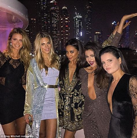 selena gomez and gigi hadid kick off 2015 as beyonce britney and gisele follow daily mail online