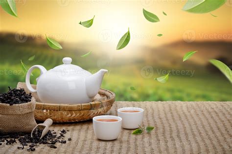 warm cup  tea  teapot flying green tea leaves   air