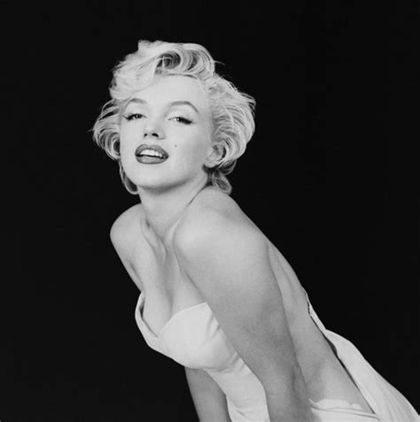 marilyn monroe writhes around naked in a bed sheet in