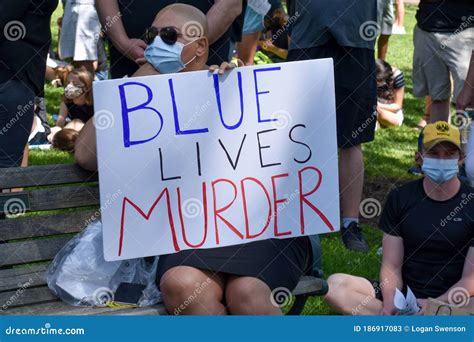 westfield nj   woman holding  sign   blue lives murder  support  black