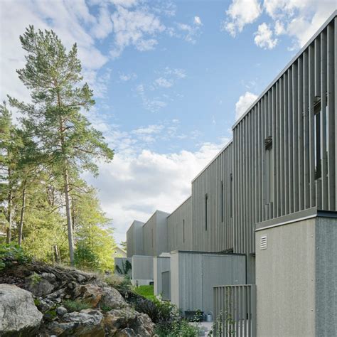 vertical slats clad terraced housing on the edge of a