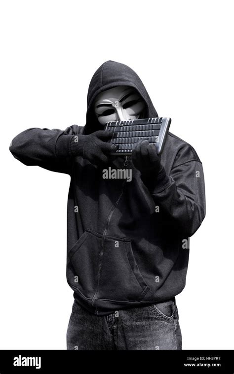 man wearing vendetta mask holding keyboard   shoot isolated  white background stock